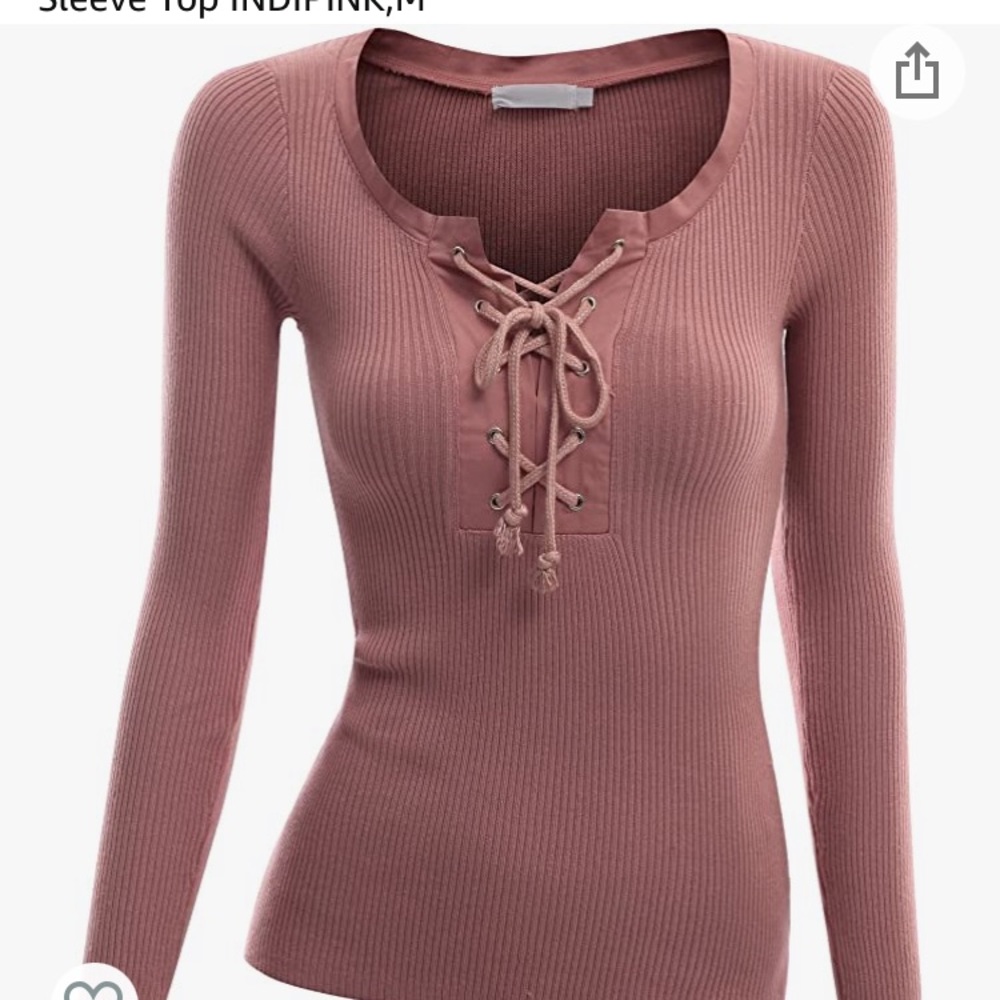 Long sleeve sweater with cross cross ties.